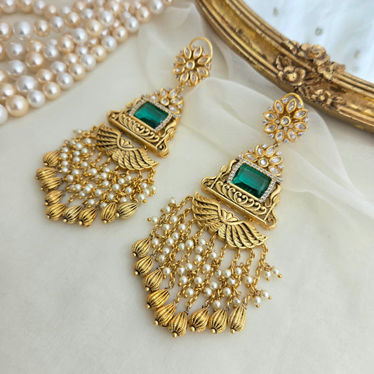 Golden and emerald danglers