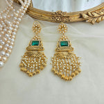 Golden and emerald danglers
