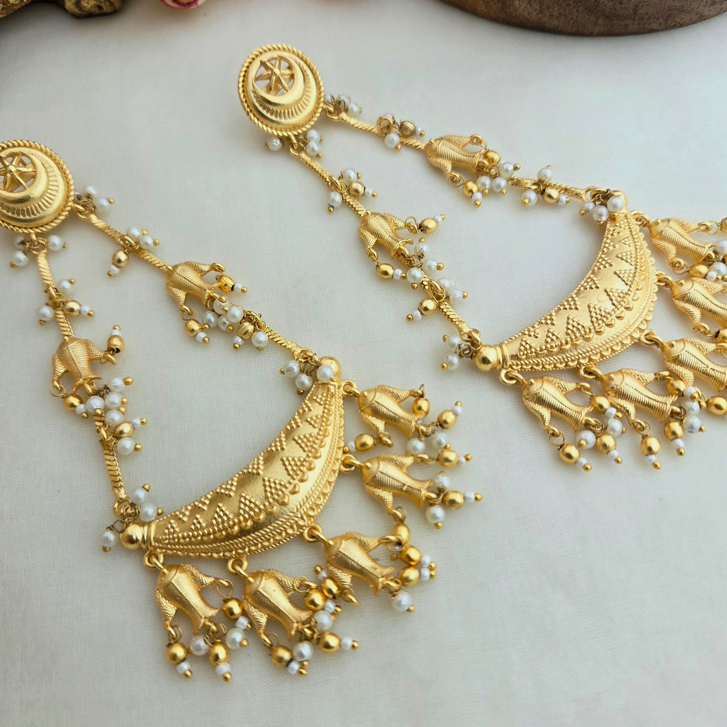 Beautiful long matsya golden earrings