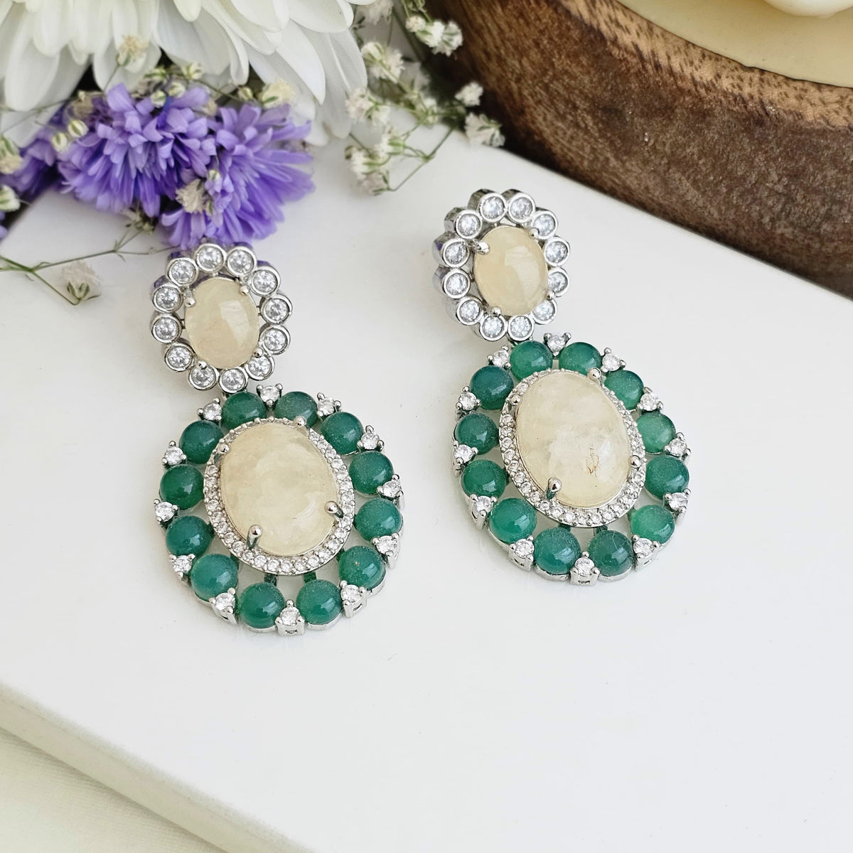 Green double halo statement earrings