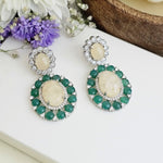 Green double halo statement earrings