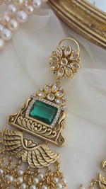 Golden and emerald danglers